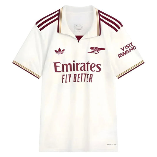 A white short-sleeve polo football shirt with maroon and gold trim, featuring the Arsenal club crest, Adidas logo, Emirates Fly Better sponsor text, and 'Visit Rwand' on the sleeve.