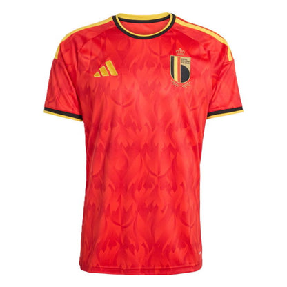 A red Belgium national football team home jersey, featuring a subtle flame pattern, yellow shoulder stripes, and the Belgium crest on the chest.