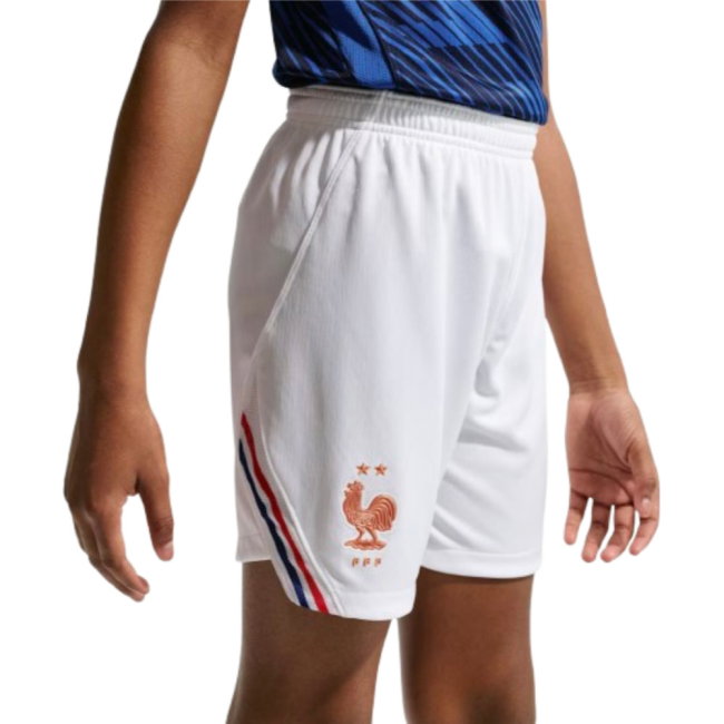 White shorts with a logo and stripes worn by a person on a white background