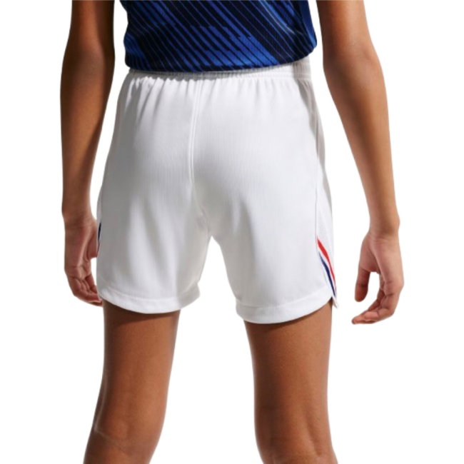 White athletic shorts worn by a person on a white background