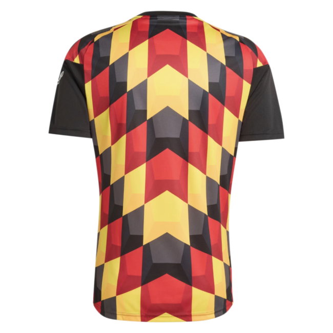 A short-sleeve athletic jersey shown from the back, featuring a bold geometric pattern of red, yellow, and black shapes, with solid black sleeves.