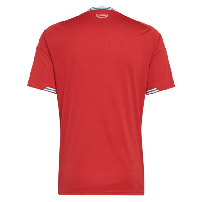 A red short-sleeve athletic jersey shown from the back, featuring a crew neck with white and blue stripes, and matching striped accents on the sleeve cuffs.