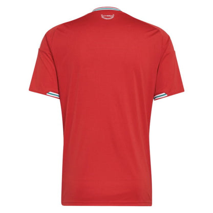 A red short-sleeve athletic jersey shown from the back, featuring a crew neck with white and blue stripes, and matching striped accents on the sleeve cuffs.