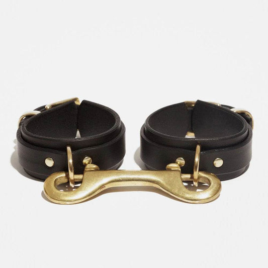 Wing style leather wrist cuffs