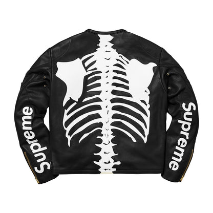 A black leather jacket shown from the back, featuring a large white skeleton ribcage graphic across the center and the word 'Supreme' printed in white along both sleeves.