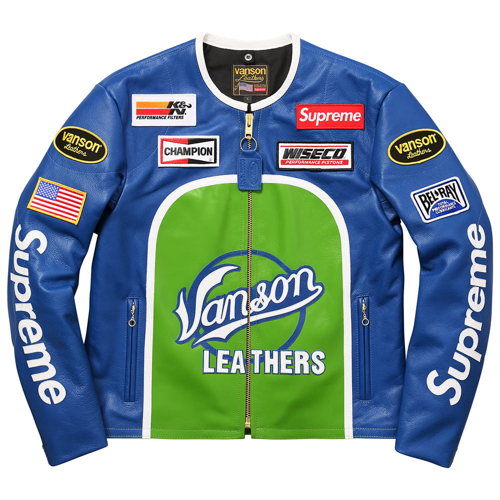 A blue and green Vanson Leathers racing jacket with Supreme branding, sponsor patches, and an American flag on the sleeve, shown flat against a white background.