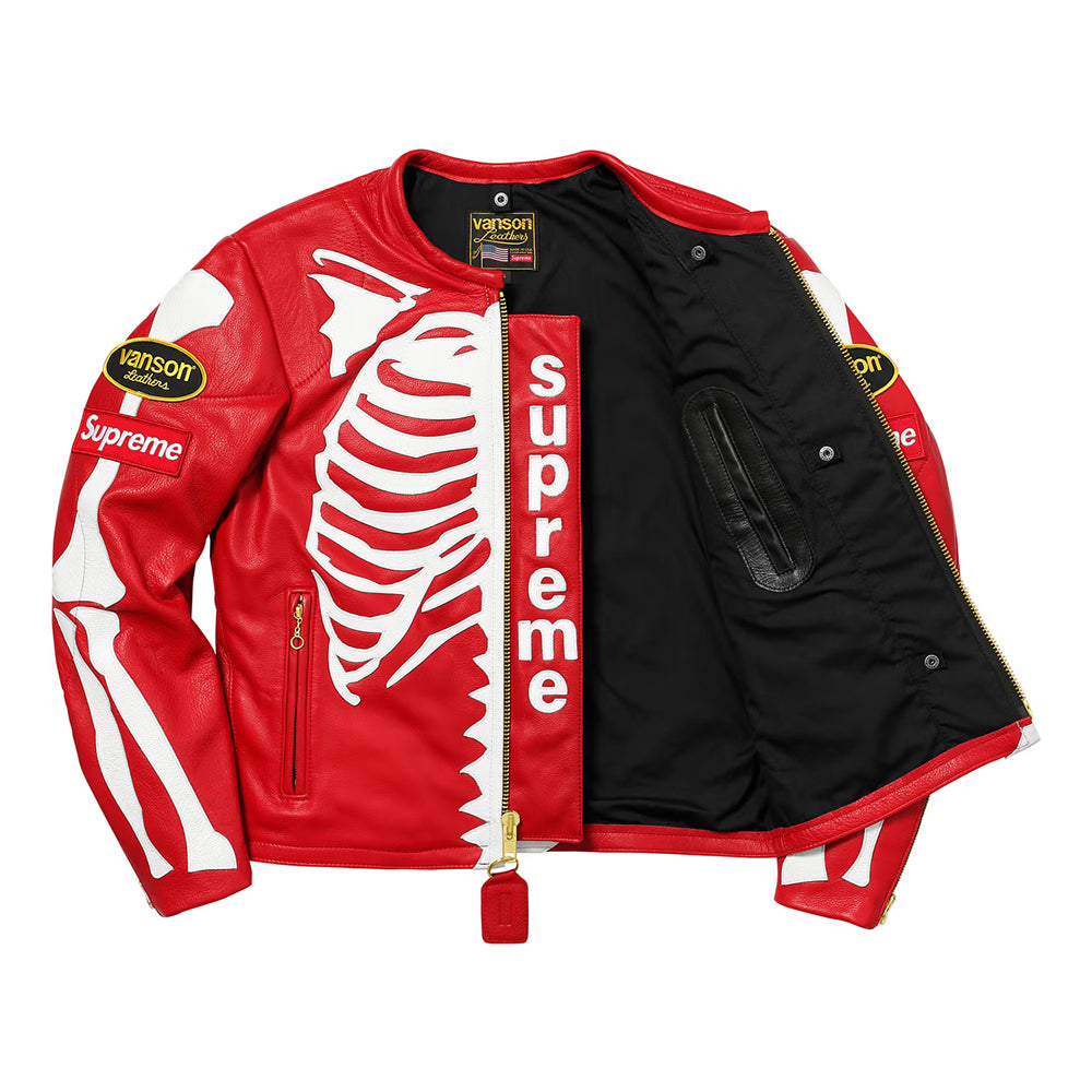 A red leather jacket from the Supreme x Hanson Racing collaboration, featuring a white skeleton rib cage graphic on the front, a red vertical zipper with 'supreme' text, and a black quilted lining.