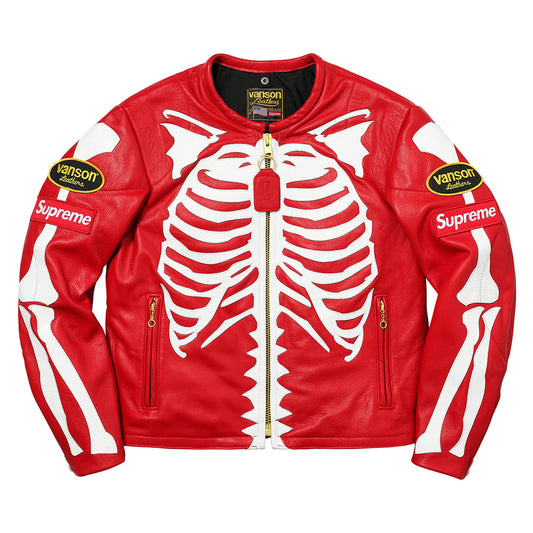 A red leather jacket featuring a white skeleton rib cage graphic across the front, with white bone graphics on the sleeves, a gold zipper, and Supreme and Vanson patches on the shoulders.