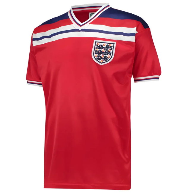 A red short-sleeve England soccer jersey with navy and white shoulder stripes, a V-neck collar, and the England crest on the chest, shown on a plain white background.