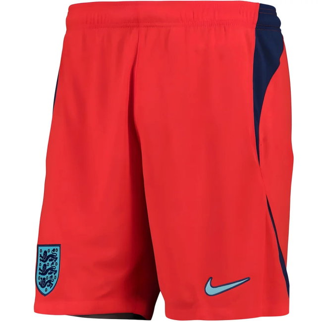 Red shorts with blue accents featuring a Nike logo on a white background