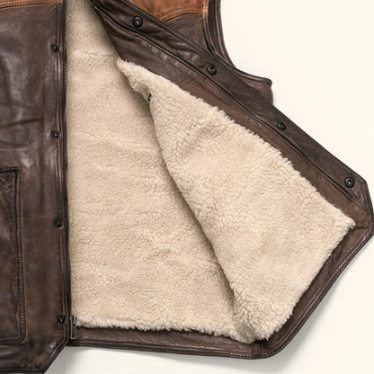 Men's tan and brown leather sherpa vest with Western yoke and distressed finish