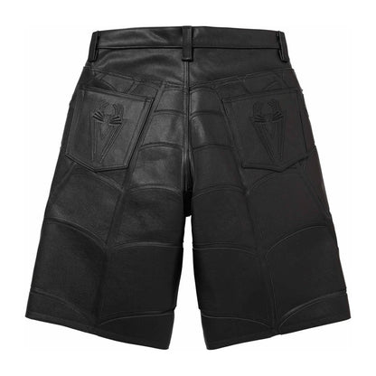 Black leather shorts with a high waist, featuring a quilted panel design and embossed spider logos on the back pockets, shown against a plain white background.